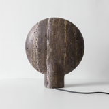 Stone lamp with a textured surface on a white background