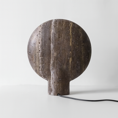 Stone lamp with a textured surface on a white background