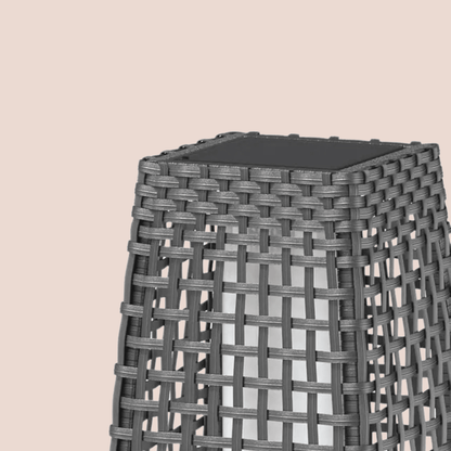 Woven stool with a black top on a beige background