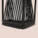Black woven lantern on a beige background