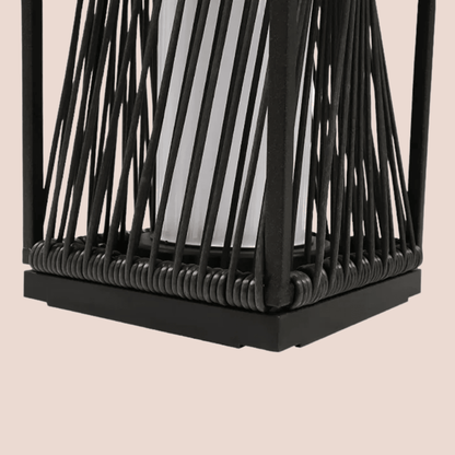 Black woven lantern on a beige background
