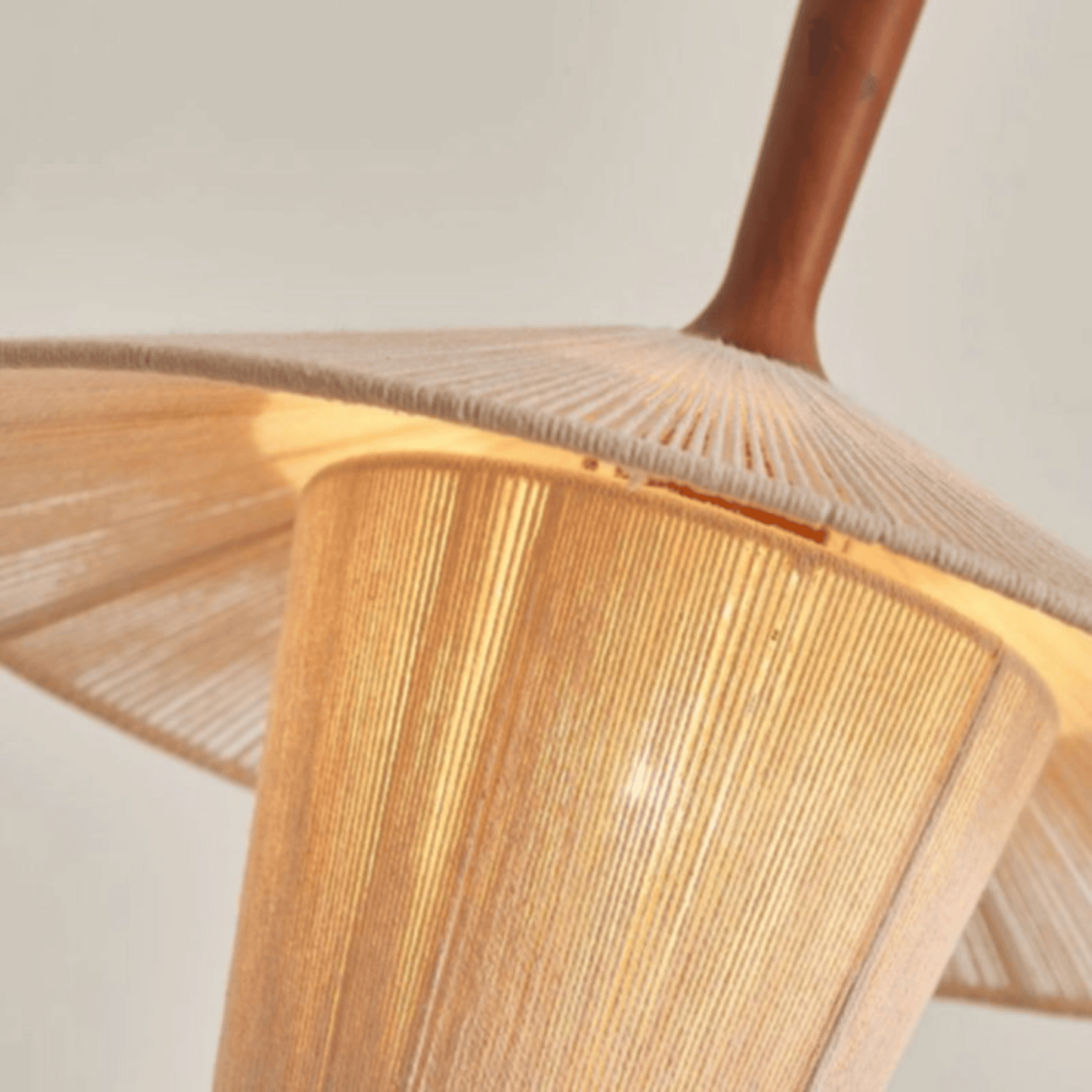 Close-up of a wooden chair with a woven seat and backrest.