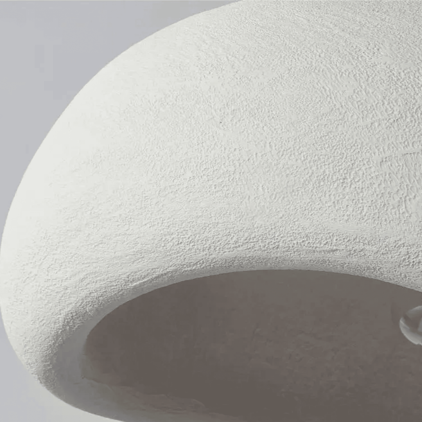 Close-up of a textured white stone surface