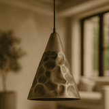 Textured pendant light fixture in a blurred indoor setting