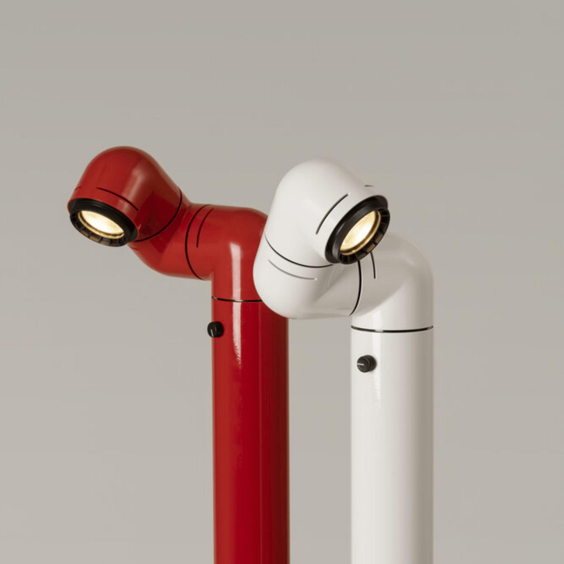 Red and white robot-like lamps on a gray background