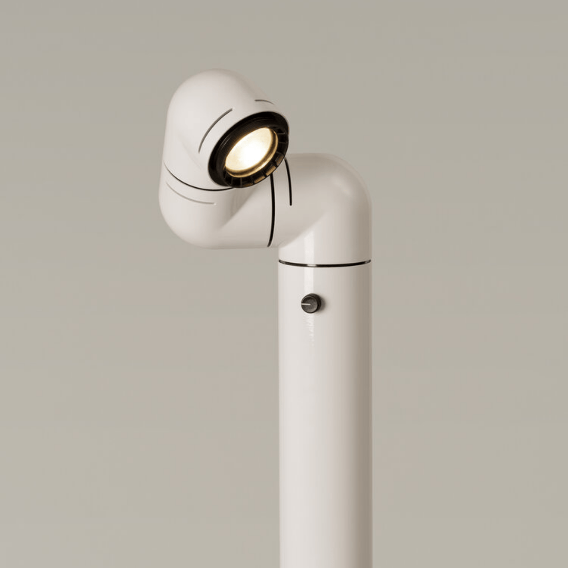 White floor lamp with a spotlight on a neutral background
