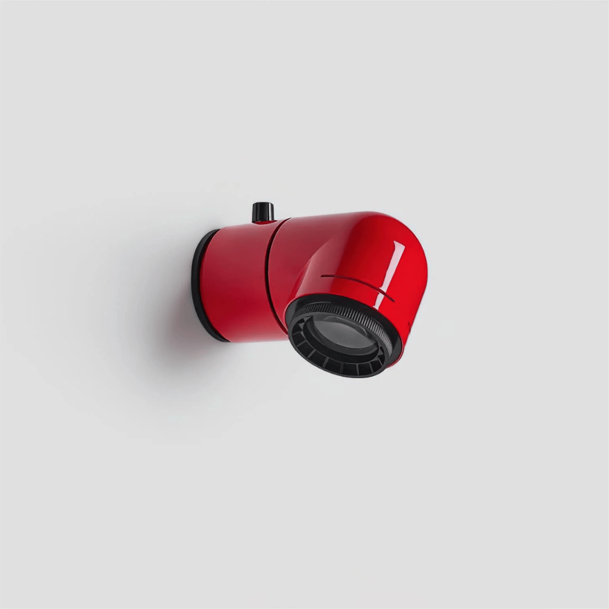 Red and black wall-mounted light fixture on a white background