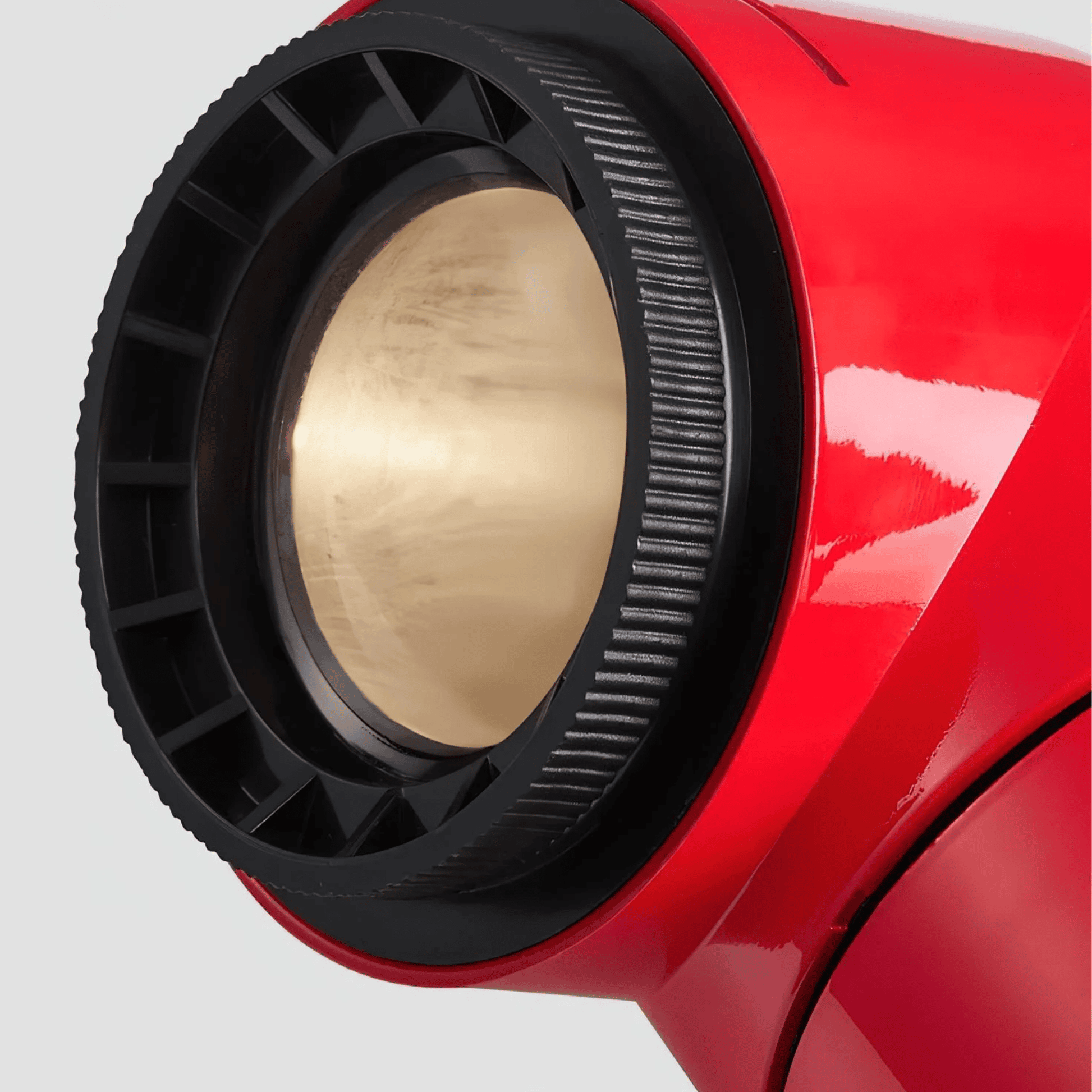 Close-up of a red and black mechanical component on a white background