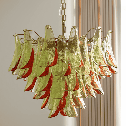 Chandelier with green and red glass panels on a neutral background