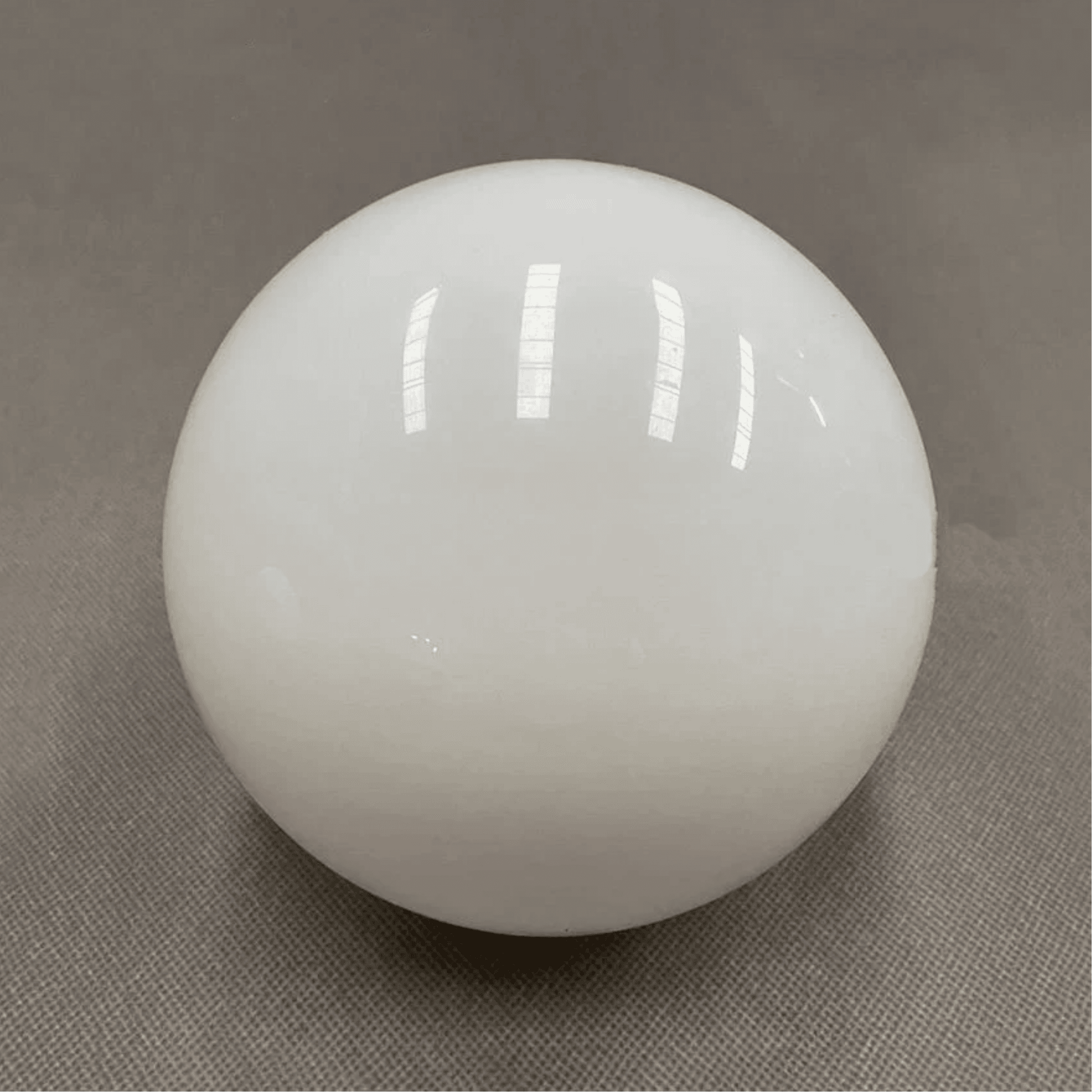 White sphere on a gray background