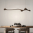 Modern dining room with a wooden table, chairs, and a decorative pendant light.