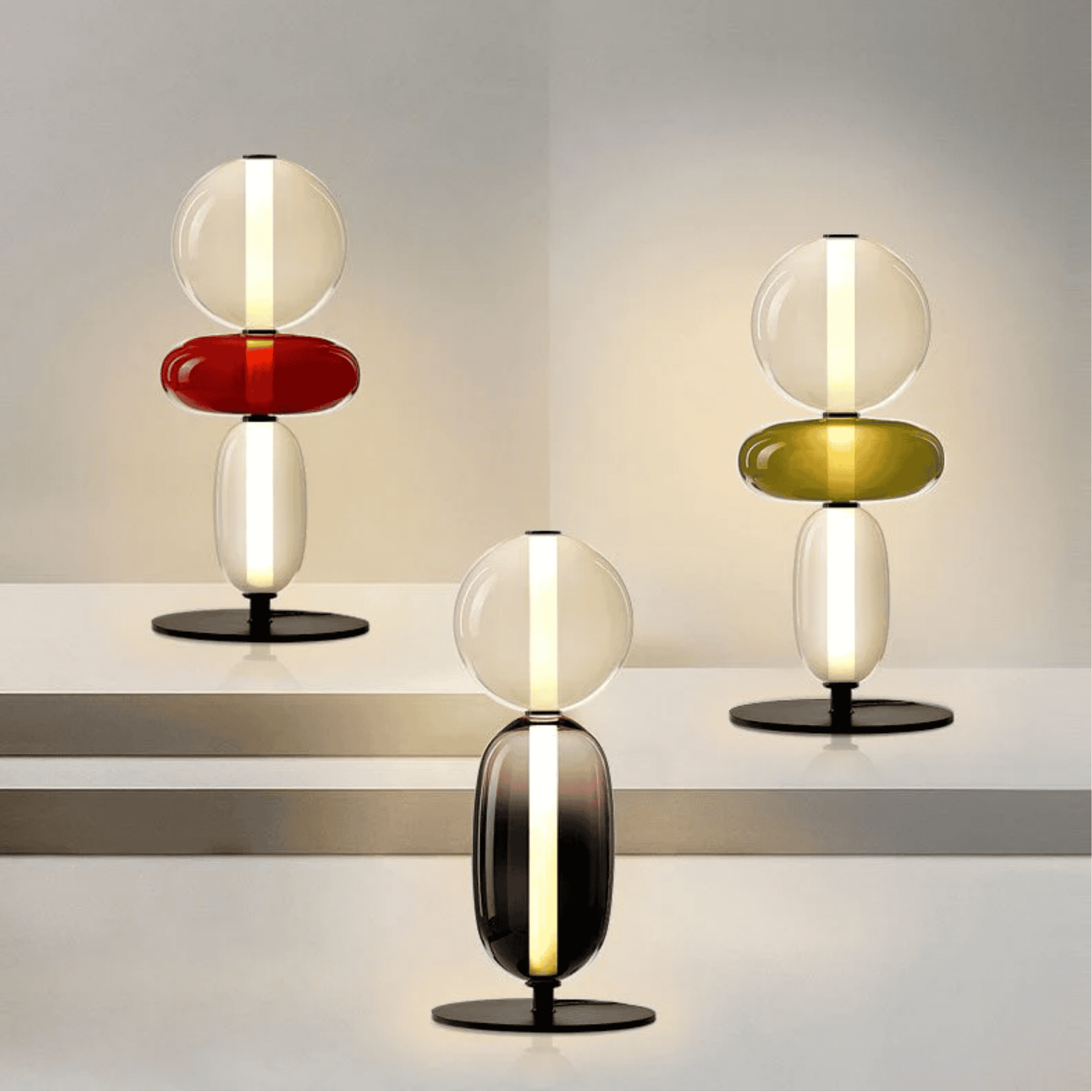 Modern table lamps with glass shades on a reflective surface