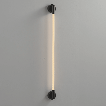Modern wall-mounted light fixture on a gray background