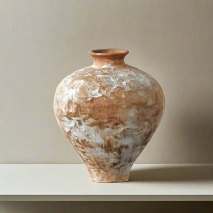 Vintage-style terracotta vase on a white background