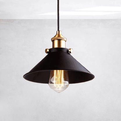Black pendant light with gold fixture on a white background