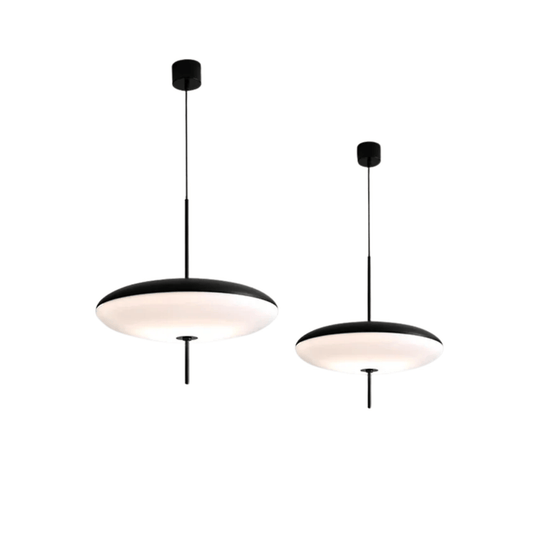 Two modern pendant lights with black frames and white shades on a white background