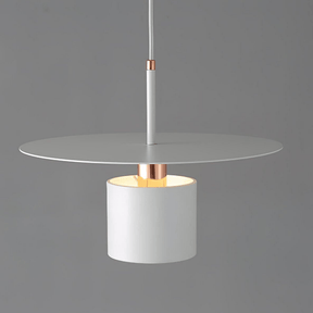 Modern pendant light with white glass shade and copper accents on a gray background