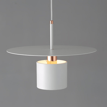 Modern pendant light with white glass shade and copper accents on a gray background