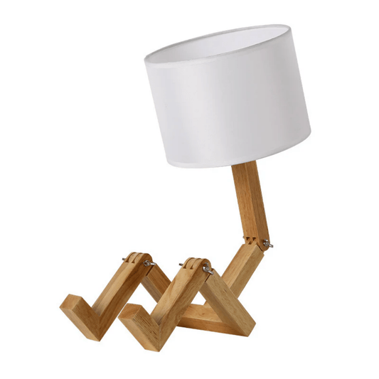 Table lamp with wooden base and white shade on a white background