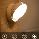 Wall-mounted light fixture on a textured wall with icons at the bottom.