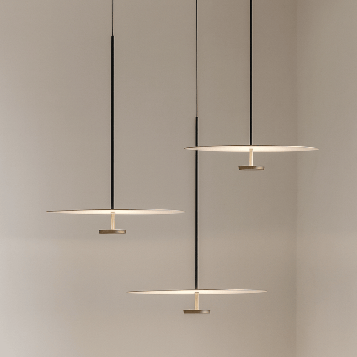 Modern pendant lights hanging against a neutral background