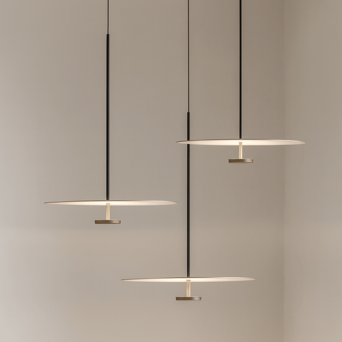 Modern pendant lights hanging against a neutral background