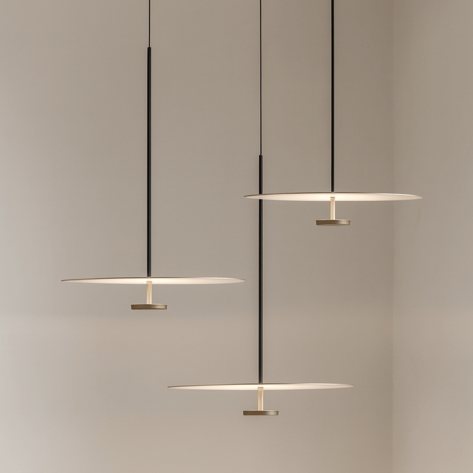 Modern pendant lights hanging against a neutral background