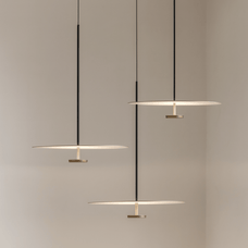 Modern pendant lights hanging against a neutral background