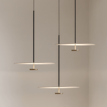 Modern pendant lights hanging against a neutral background