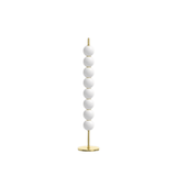 Decorative floor lamp with white spherical beads and gold base on a white background
