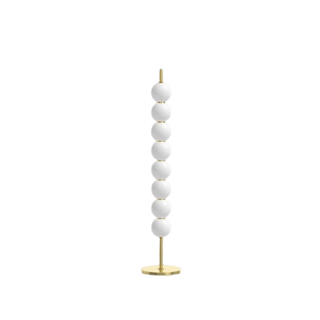 Decorative floor lamp with white spherical beads and gold base on a white background