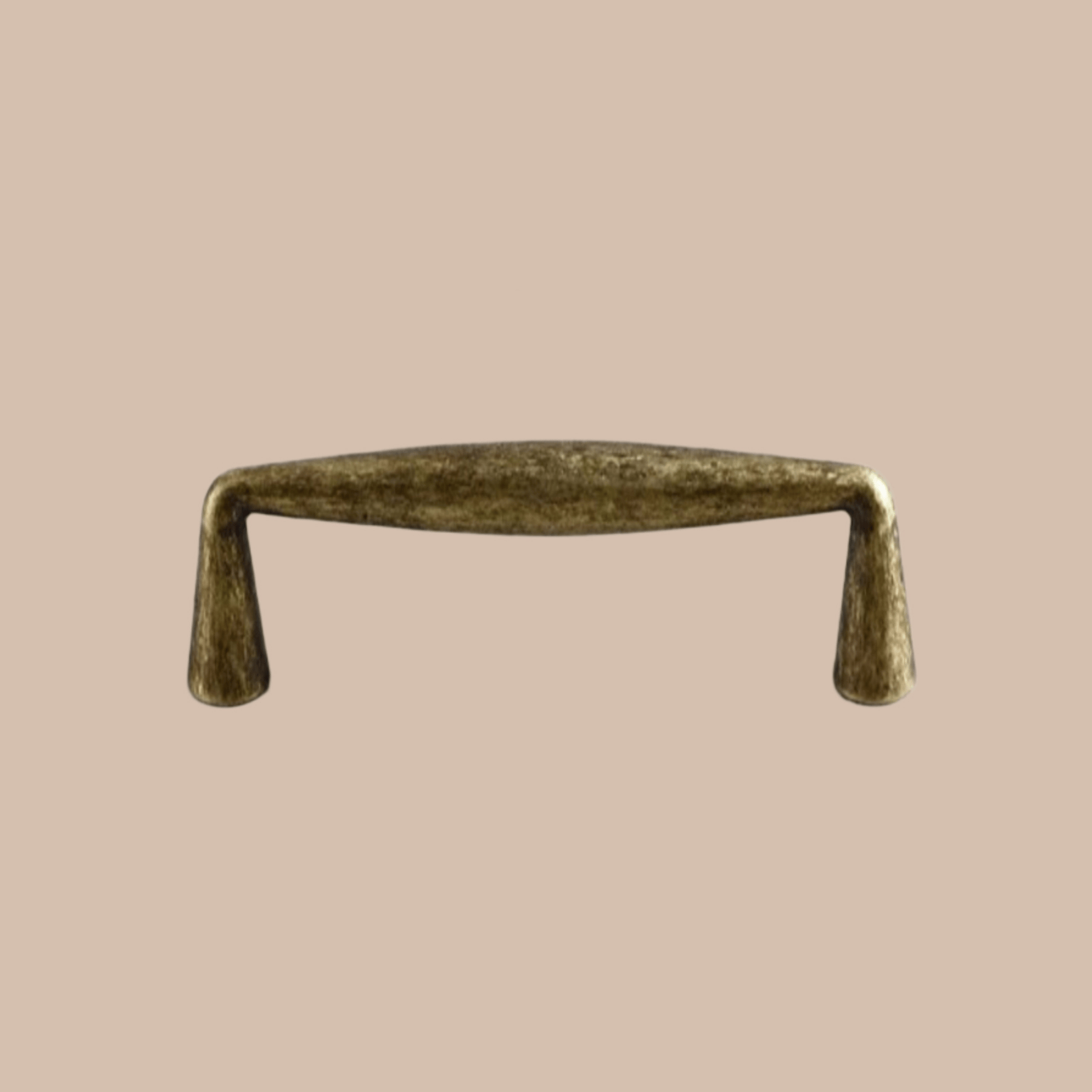 Bronze cabinet handle on a beige background