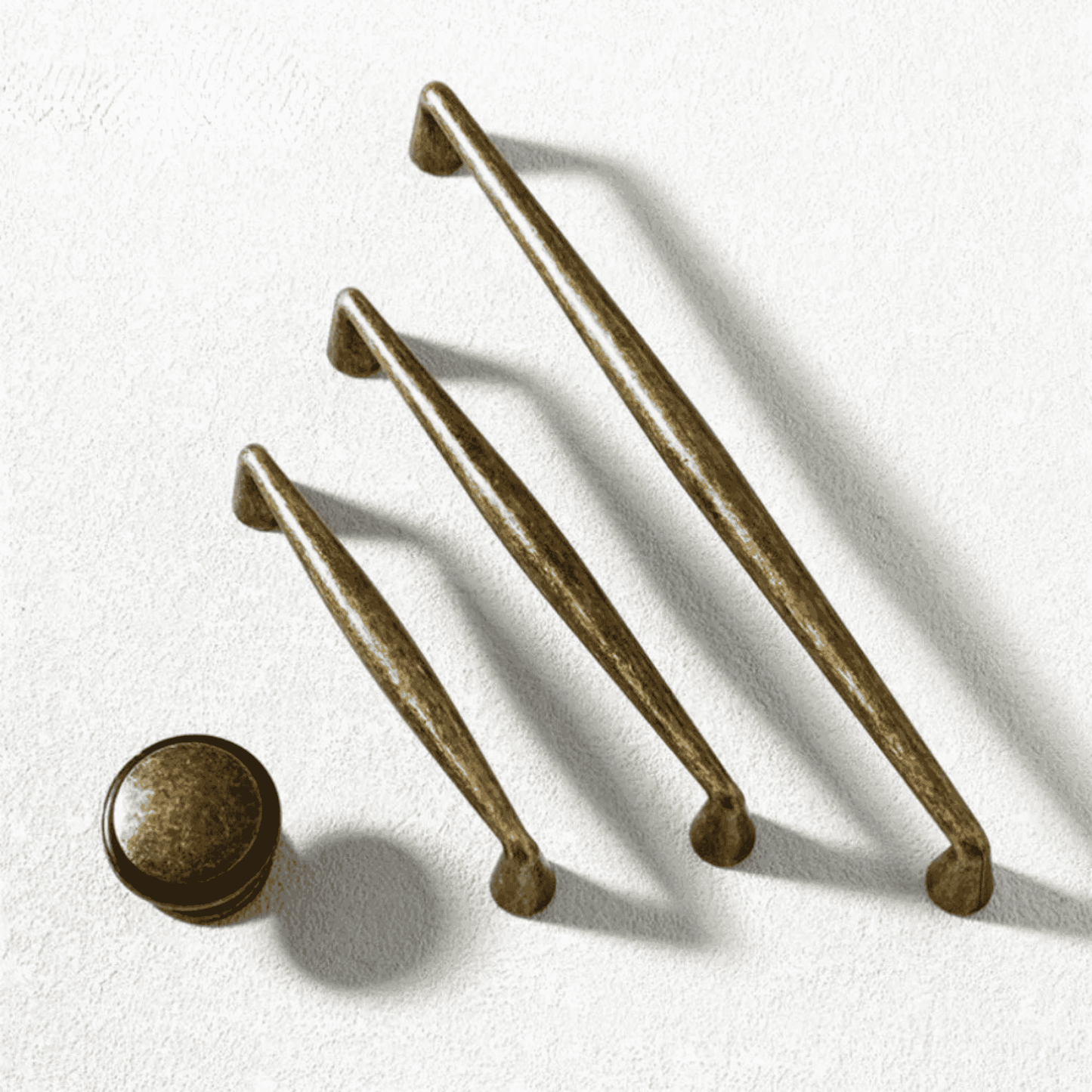Set of bronze cabinet handles on a white background