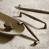 Brass hardware components on a textured surface