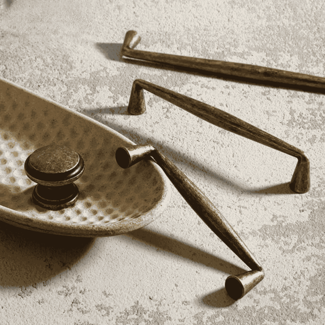 Brass hardware components on a textured surface
