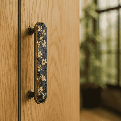 Decorative door handle on a wooden door with a blurred background
