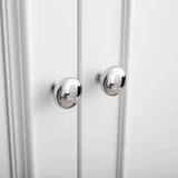 Close-up of a white cabinet with silver knobs on a white background