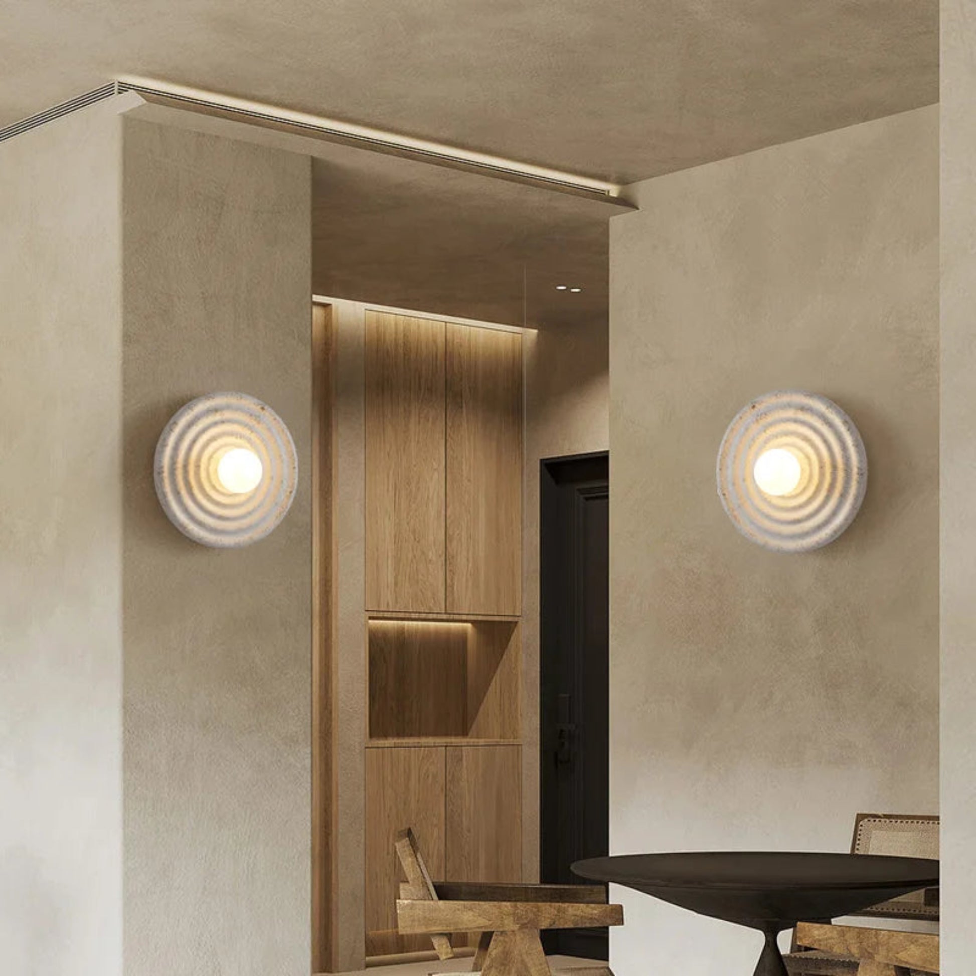 Modern interior design with wall lights and wooden furniture.