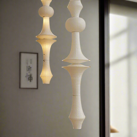 Decorative ceiling light fixture with a white and beige design on a white background