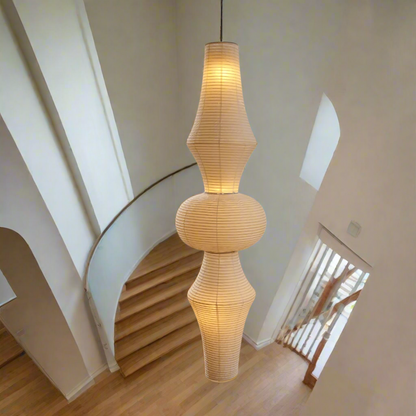 Beige pendant lamp with a ribbed design on a white background