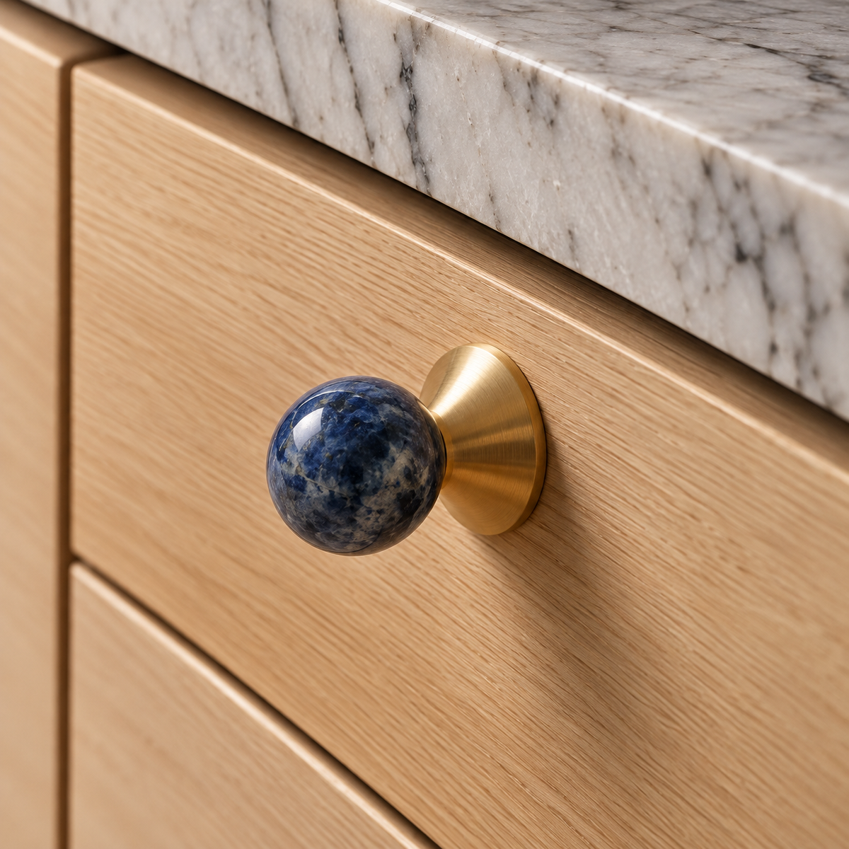 Solvi Brass Ball Cabinet Knobs – Blue Veined – Close-up installed on oak cabinetry