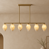 Alabaster chandelier – L120cm – clean background Clean premium real beige plaster architectural background, minimal empty space, correctly installed light with ceiling or wall surface visible and natural shadows.