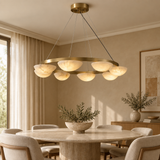 Alabaster chandelier – D80cm – lifestyle Installed above dining table in elegant warm beige dining room, ceiling connection visible, exact scale relative normal furniture.