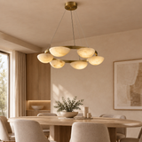 Alabaster chandelier – D60cm – lifestyle Installed above dining table in elegant warm beige dining room, ceiling connection visible, exact scale relative normal furniture.