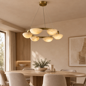 Alabaster chandelier – D60cm – lifestyle Installed above dining table in elegant warm beige dining room, ceiling connection visible, exact scale relative normal furniture.