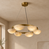 Alabaster chandelier – D60cm – clean background Clean premium real beige plaster architectural background, minimal empty space, correctly installed light with ceiling or wall surface visible and natural shadows.