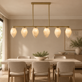 Alabaster chandelier – L120cm – lifestyle Installed above dining table in elegant warm beige dining room, ceiling connection visible, exact scale relative normal furniture.