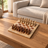 A beige and brown Natural Stone Carved Chess Set — lifestyle photograph