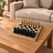 D beige border black pieces Natural Stone Carved Chess Set — lifestyle photograph