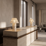 Two Baskoraa shell mushroom table lamps on a luxury hotel reception desk